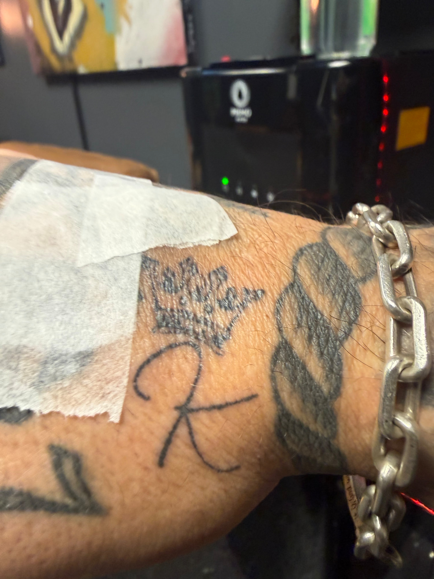 Forearm script tattoo before laser treatment